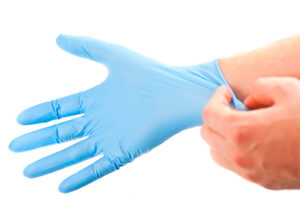 get ready for treatment doctors hand in blue hygienic glove