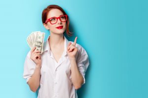Woman wearing red glasses with money in her hand