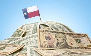 Flag of Texas sticking in american banknotes.(series)